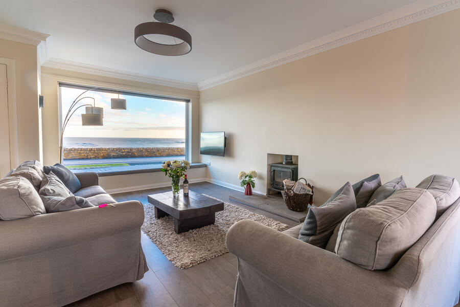 Spacious living room with wood-burning stove